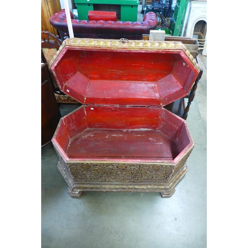 205 - An eastern carved wood casket shaped blanket box