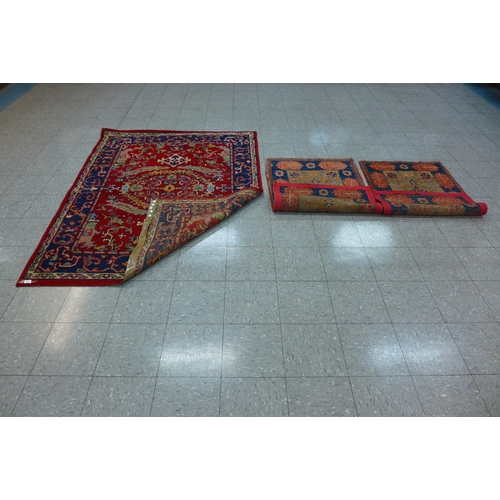 209 - A pair of cream and blue ground prayer rugs and one other