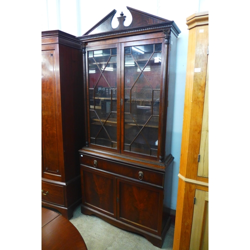 223 - A George IV style mahogany secretaire bookcase