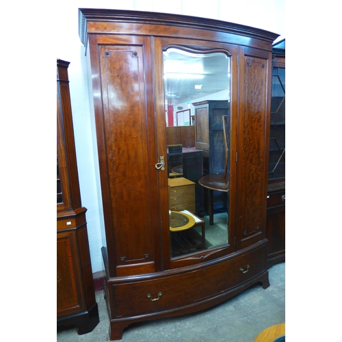 224 - An Edward VII mahogany bow front wardrobe