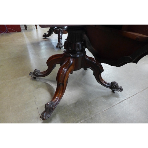 28 - An early Victorian rosewood serpentine tilt-top centre table