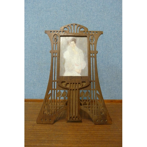 380 - An Art Nouveau carved wood picture frame