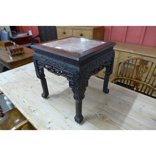 5 - An early 20th Century Chinese padouk wood and marble topped jardiniere stand