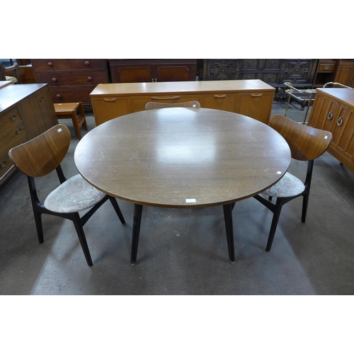 52 - A G-Plan Librenza tola wood and black circular dining table and three chairs