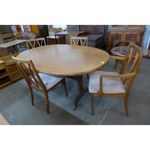 62 - A G-Plan Fresco teak extending dining table and four chairs