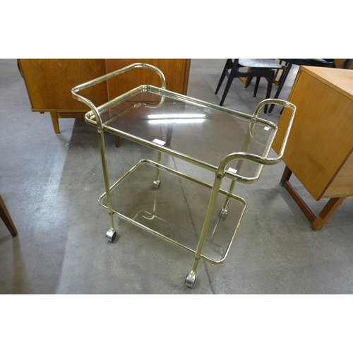 67 - An Italian brass and glass two tier cocktail trolley