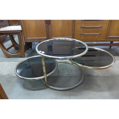 70 - An Italian tubular metal and smoked glass coffee table, manner of Milo Baughman