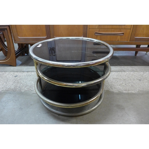 70 - An Italian tubular metal and smoked glass coffee table, manner of Milo Baughman