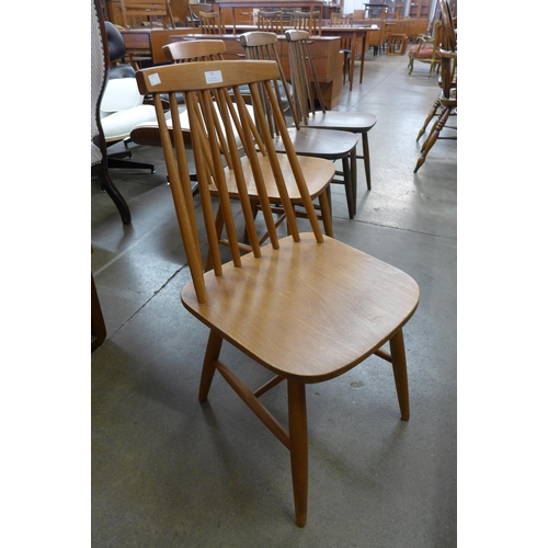 77 - A set of four beech kitchen chairs