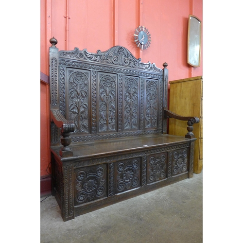 8 - A Victorian Elizabethan Revival carved oak settle