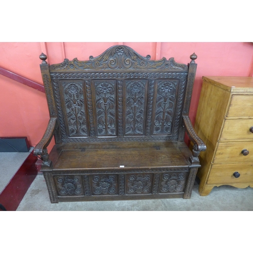 8 - A Victorian Elizabethan Revival carved oak settle