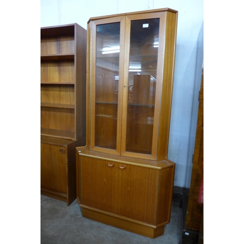 81 - A Turnidge of London teak freestanding corner cabinet