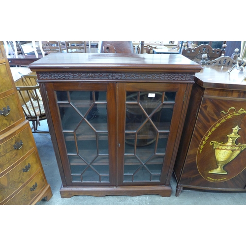 96 - A George IV style mahogany two door bookcase