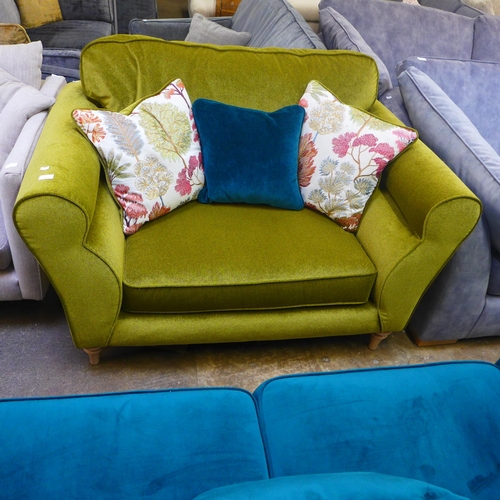 1333 - A metallic sheen green upholstered loveseat with patterned scatter cushions