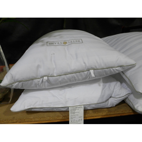 3354 - Two Hotel Grand Down Roll  Jumbo Pillows (283-507) * This lot is subject to VAT