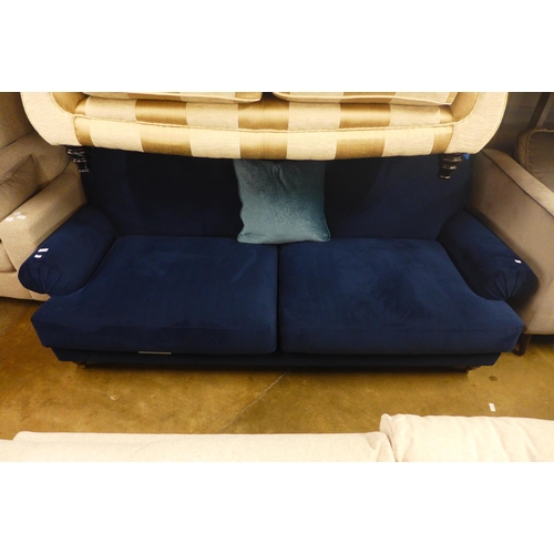 1439 - A midnight blue velvet four seater sofa - marked