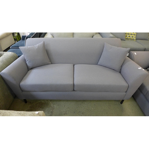 1589 - A Parma violet upholstered three seater sofa