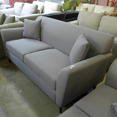 1589 - A Parma violet upholstered three seater sofa