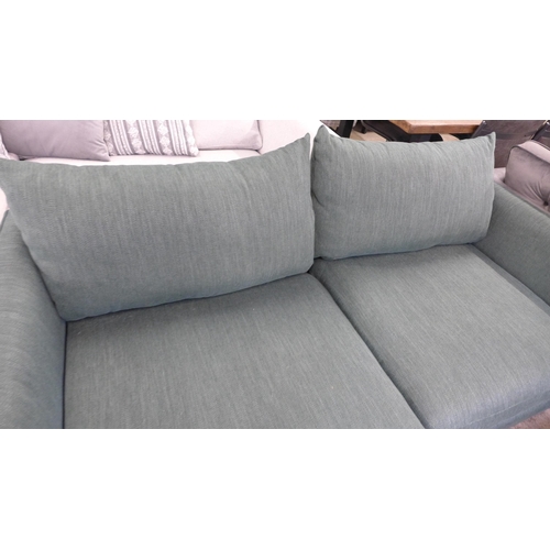 1458 - A forest green textured weave three seater sofa