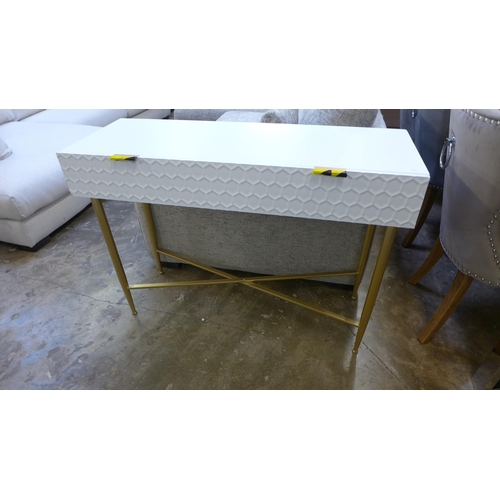 1460 - A white console table with gold legs