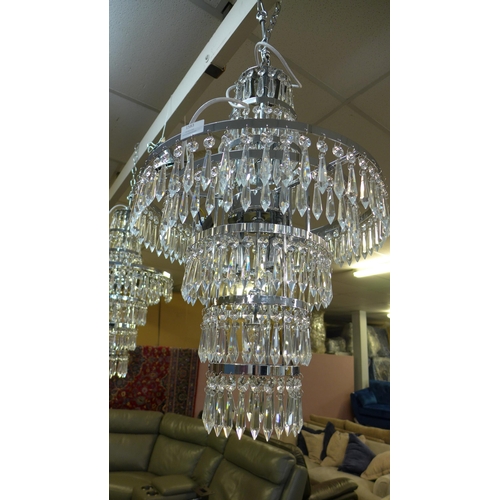 1583 - A glass three tier crystal chandelier