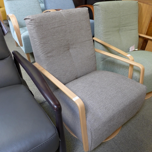 1594 - A Yoko vista grey upholstered swivel rocking chair RRP £999