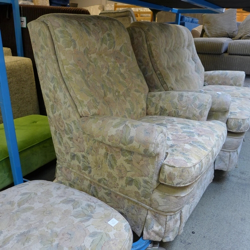 1597 - A floral patterned upholstered two seater sofa and an armchair with footstool