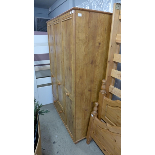 1654 - A pine three door, single drawer wardrobe