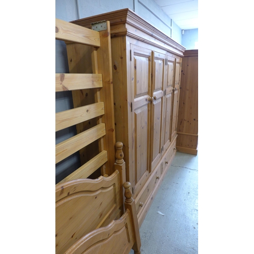 1656 - A pine four door, two drawer wardrobe