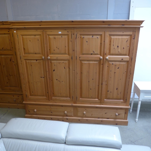 1657 - A pine four door, two drawer wardrobe