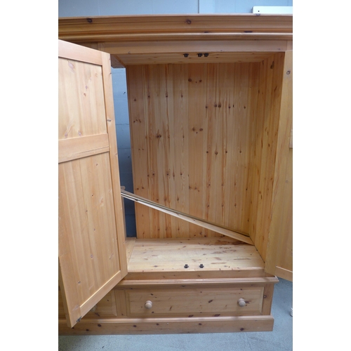 1657 - A pine four door, two drawer wardrobe