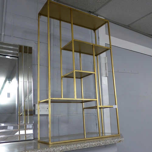 1517 - A gold mirrored shelf unit