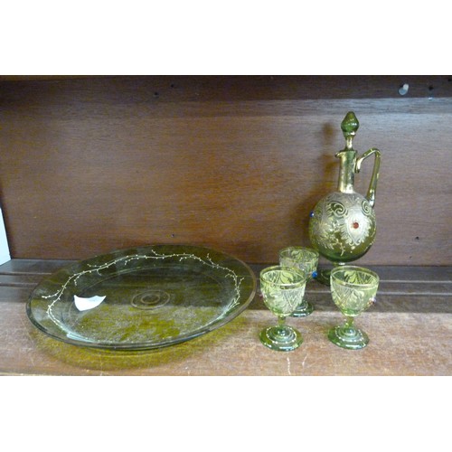 669 - A 19th Century green glass decanter, three glasses, glass tray, one glass and decanter a/f