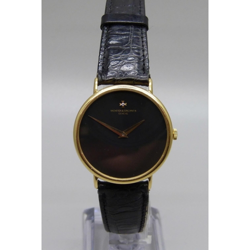 1062 - An 18ct gold Vacheron & Constantin Geneve dress wristwatch, the 33mm case marked 520950, on a black ... 