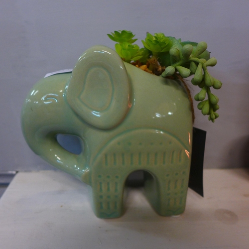 1305 - A faux succulent plant in a green ceramic elephant pot- H 17cms  (67689704 )