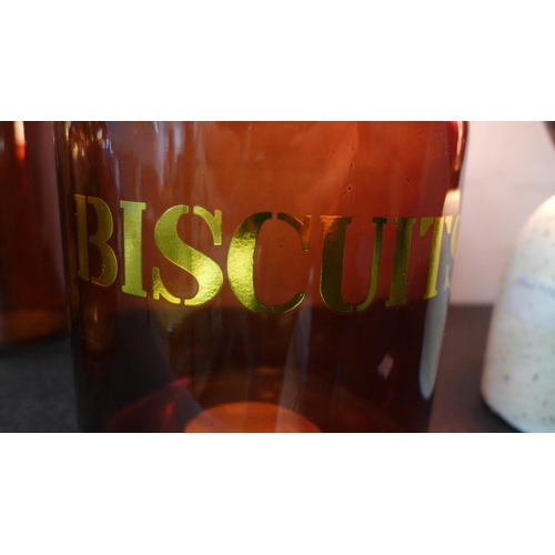 1309 - An amber glass biscuit jar - H 21cms (67825905)