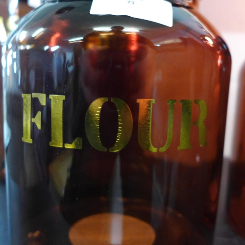 1310 - An amber glass flour jar - H 21cms (67840205)