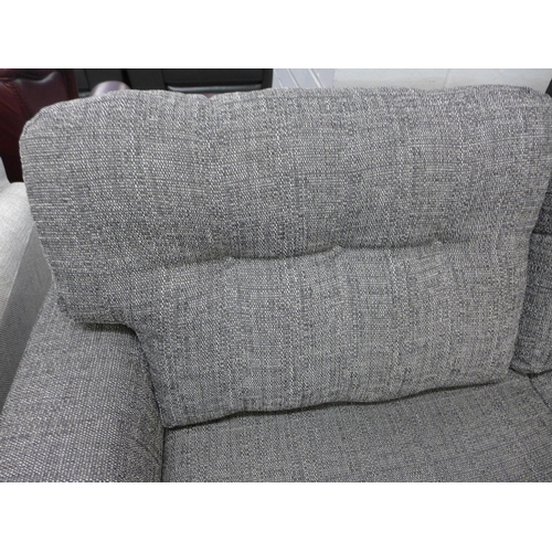 1342 - A charcoal upholstered three seater sofa