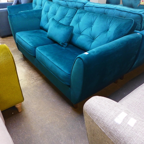 1345 - A teal velvet button back three seater sofa