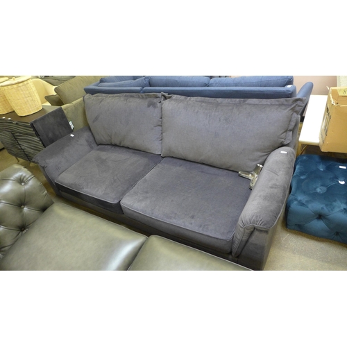 1379 - A grey velvet four seater sofa