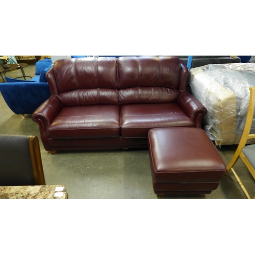 1393 - A Wade Upholstery burgundy leather high back four seater sofa with footstool