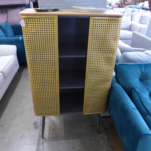 1396 - A gold rattan effect industrial style cabinet
