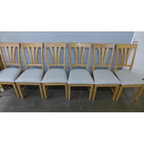 1405 - A set of six oak dining chairs with light grey upholstered seats