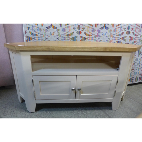 1409 - A 90 degree corner TV unit with two doors and 2 shelves  * This lot is subject to VAT