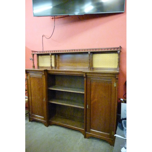 106 - A Victorian Aesthetic Movement walnut breakfront bookcase