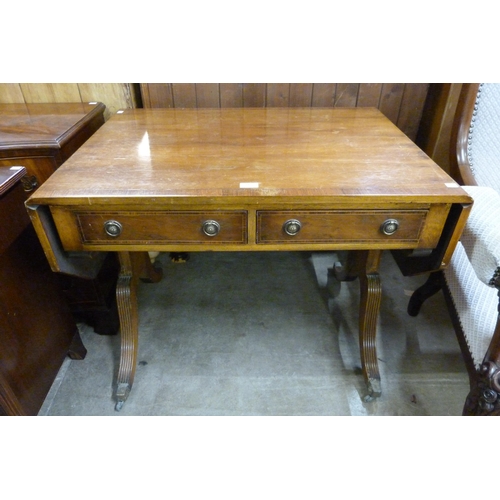 142 - A Regency style inlaid mahogany and yew wood sofa table