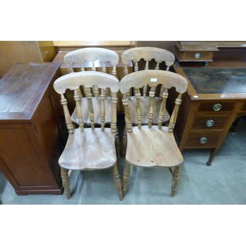 144 - A set of four Victorian elm and beech kitchen chairs