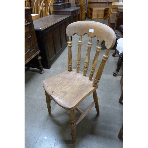 144 - A set of four Victorian elm and beech kitchen chairs