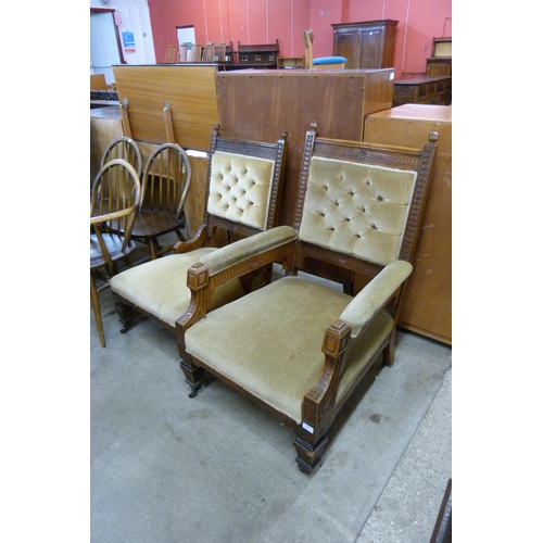 146 - A pair of Victorian Aesthetic Movement carved oak and green fabric upholstered lady's and gentleman'... 