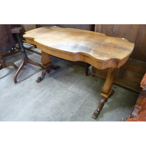 165 - A Victorian style walnut single drawer library table